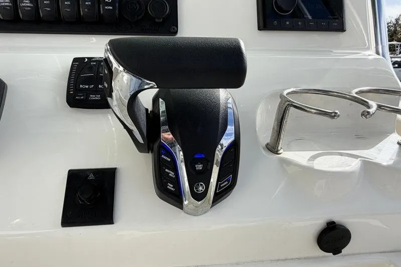 Slide: The Image of Throttle control panel on a 2025 Key West 239 FS boat dashboard. - 30