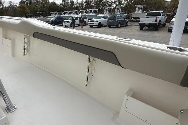 Slide: The Image of 2025 Key West 239 FS boat interior with parking lot background. - 38