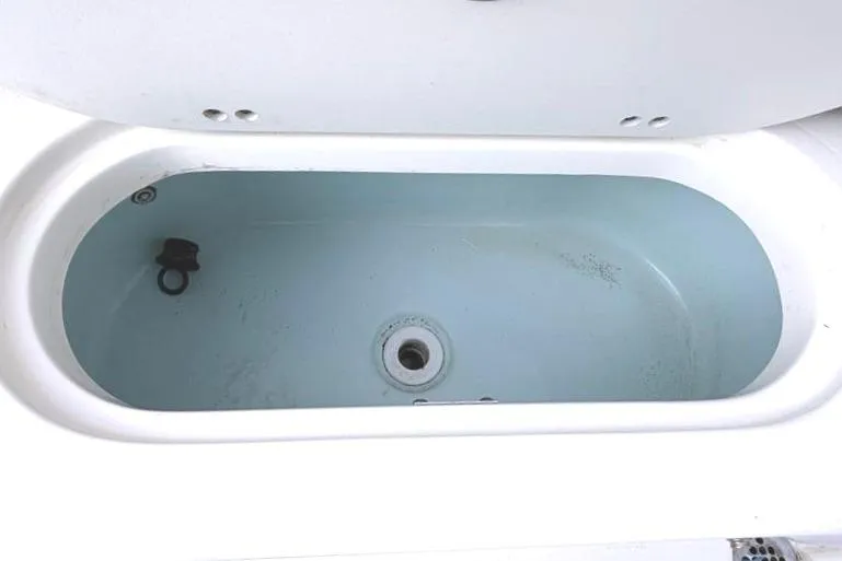 Slide: The Image of Livewell compartment in 2025 Key West 239 FS boat, open lid view. - 40