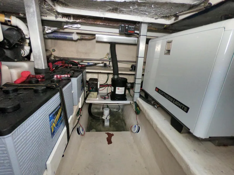 Slide: The Image of Engine room of 2005 Stamas 370 Express with batteries and generator. - 18