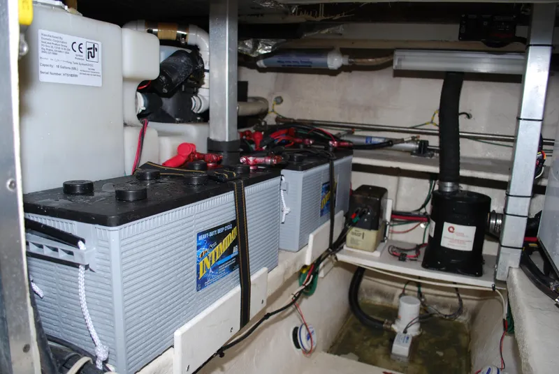 Slide: The Image of Engine room of 2005 Stamas 370 Express with batteries and wiring. - 22