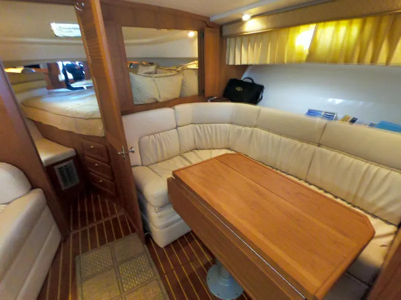 Slide: The Image of 2005 Stamas 370 Express cabin with cozy seating and wooden table. - 40