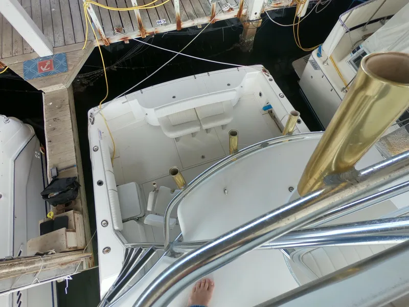 Slide: The Image of 2005 Stamas 370 Express boat docked, viewed from above, showing spacious deck and seating area. - 9