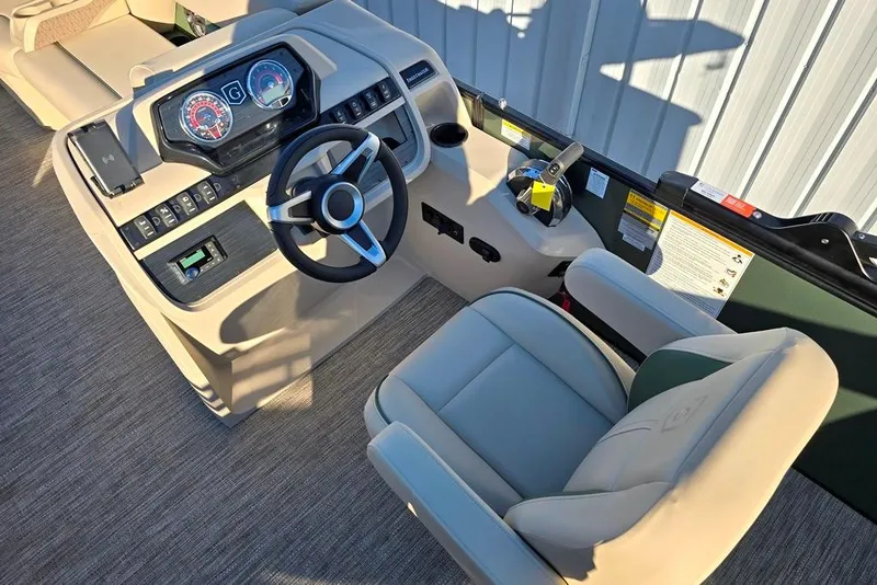 Slide: The Image of 2026 Sweetwater 2086 CRUISE boat interior with steering wheel and control panel. - 2