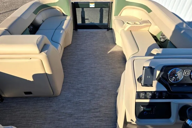 Slide: The Image of 2026 Sweetwater 2086 CRUISE boat interior with beige seating and modern dashboard. - 3