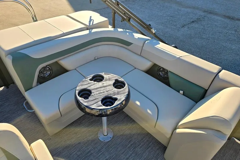 Slide: The Image of Luxurious seating area on 2026 Sweetwater 2086 CRUISE boat with cupholder table. - 4