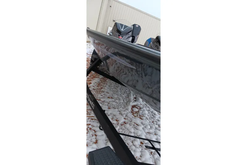 Slide: The Image of 2025 Ranger ALPHA 208 boat on snowy ground, side view. - 11