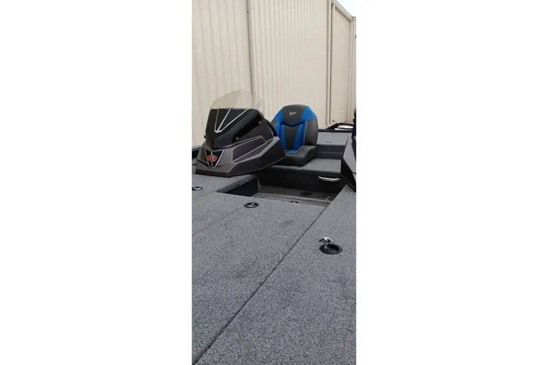 Slide: The Image of 2025 Ranger ALPHA 208 boat interior with blue and black seating, sleek design. - 14