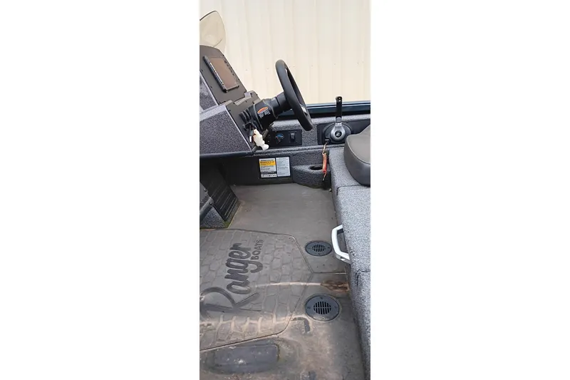 Slide: The Image of Interior of 2025 Ranger ALPHA 208 boat showing steering and controls. - 15