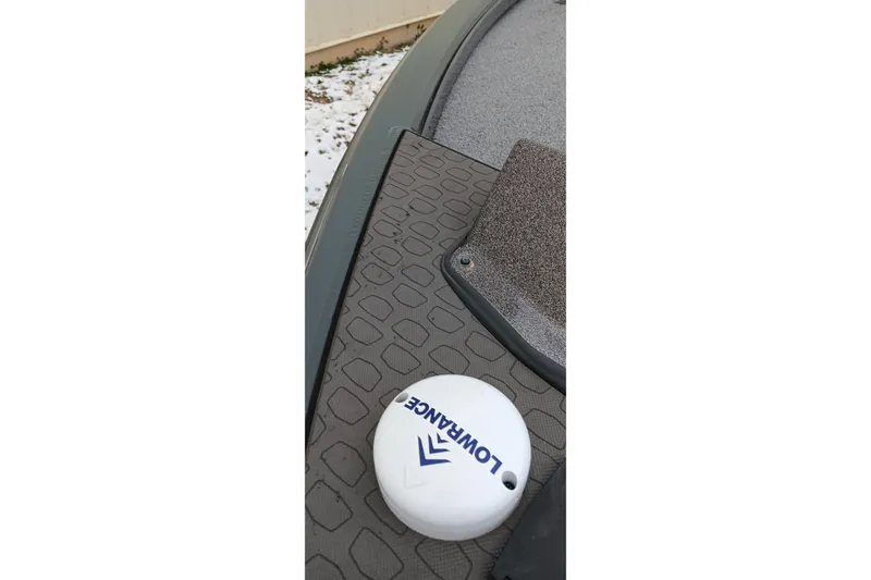 Slide: The Image of 2025 Ranger ALPHA 208 boat deck with Lowrance equipment, featuring textured surface. - 16