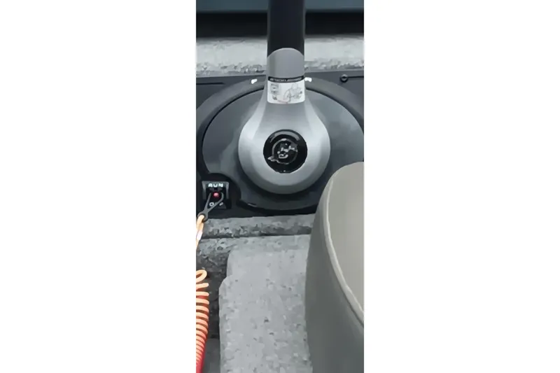 Slide: The Image of 2025 Ranger ALPHA 208 boat control panel with ignition switch and run button. - 18