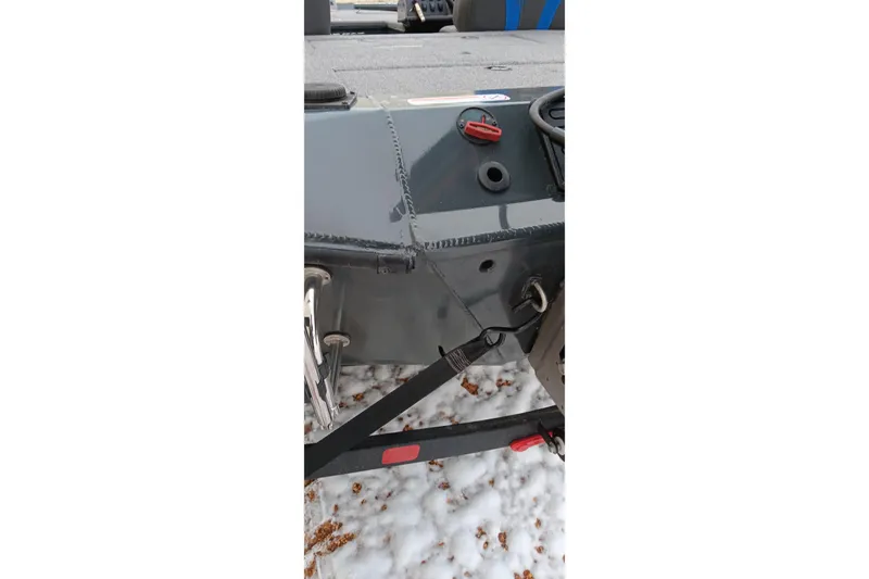 Slide: The Image of Close-up of 2025 Ranger ALPHA 208 boat detail on snowy ground. - 24