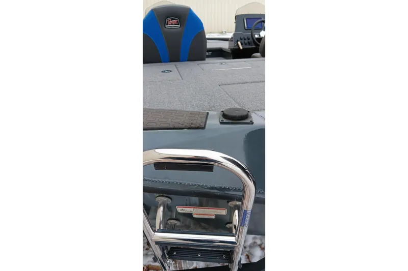 Slide: The Image of 2025 Ranger ALPHA 208 boat interior with blue and gray seating and chrome ladder. - 25
