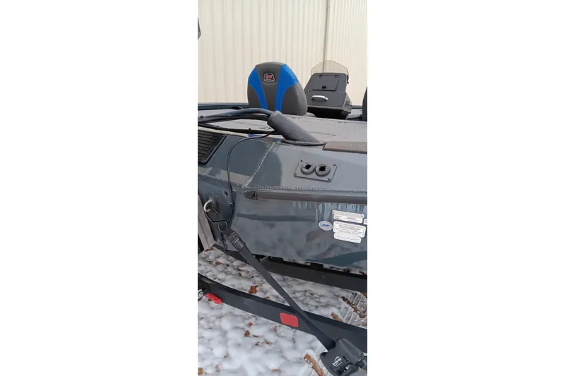 Slide: The Image of 2025 Ranger ALPHA 208 boat on snowy ground, featuring sleek design and modern seating. - 28