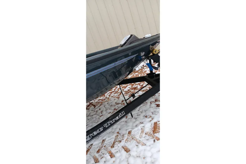 Slide: The Image of Ranger ALPHA 208 boat on trailer, snowy ground, 2025 model. - 31