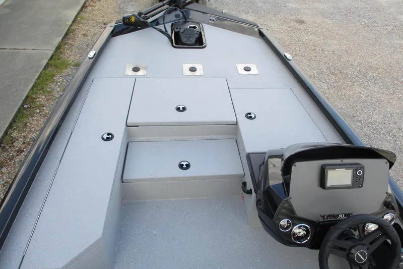 Slide: The Image of 2026 Vexus AVX189 boat interior with steering console and storage compartments. - 11