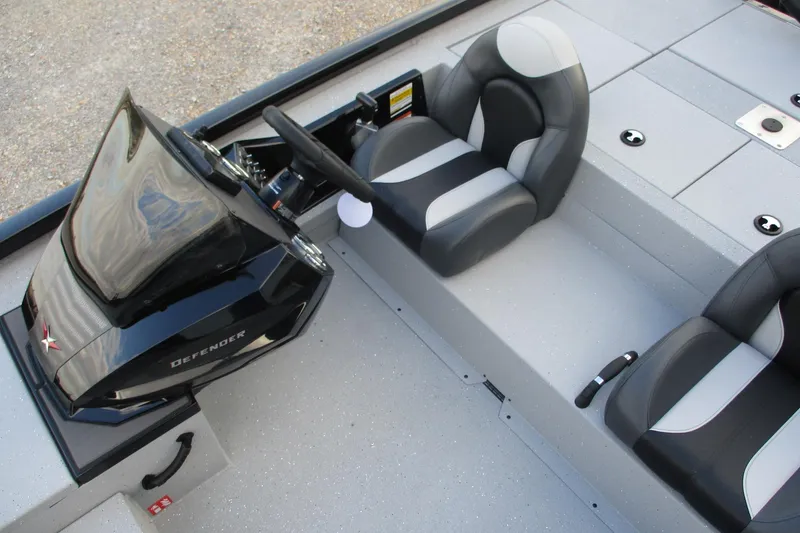 Slide: The Image of 2026 Vexus AVX189 boat interior with black and gray seating and steering console. - 12