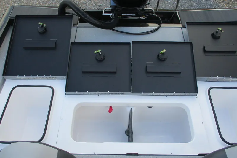 Slide: The Image of 2026 Vexus AVX189 boat storage compartments and livewell, featuring black lids and white interior. - 14