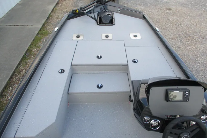 Slide: The Image of 2026 Vexus AVX189 boat interior with steering console and storage compartments. - 16