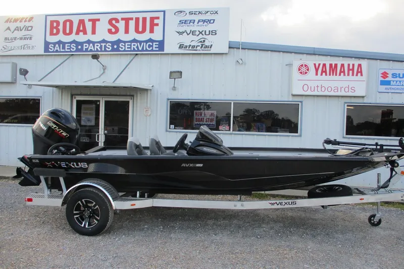 The Image of 2026 Vexus AVX189 boat on trailer outside dealership, featuring Yamaha outboard motor. - 0