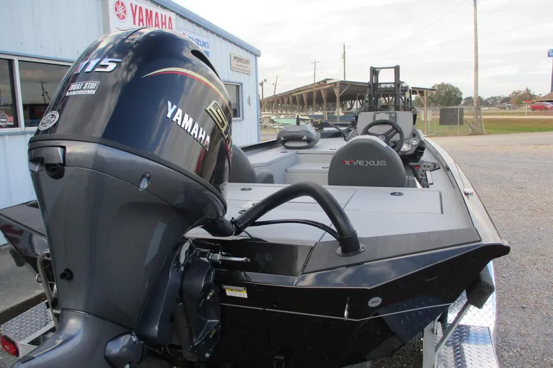 Slide: The Image of 2026 Vexus AVX189 boat with Yamaha 115 engine, parked outside dealership. - 17