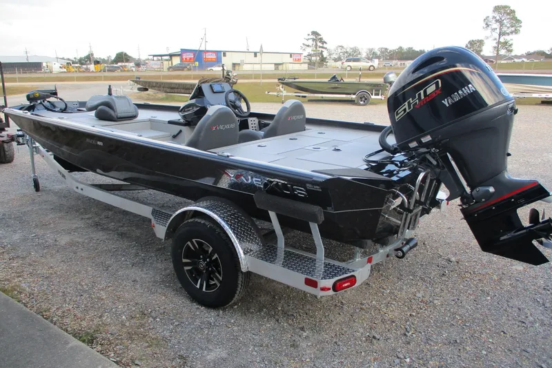 Slide: The Image of 2026 Vexus AVX189 boat with Yamaha engine on trailer, parked outdoors. - 2