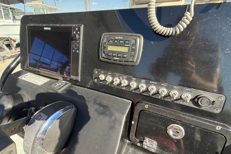 Slide: The Image of 2018 Blazer Bay 2420 GTS boat dashboard with controls and navigation system. - 15
