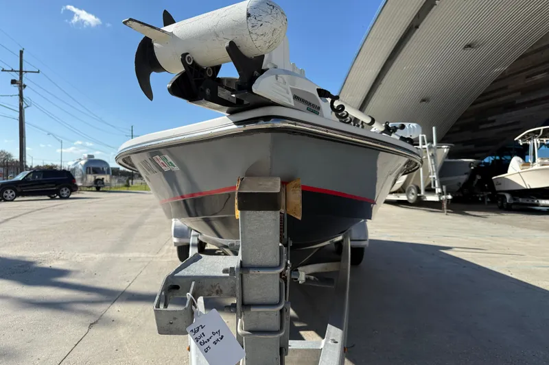 Slide: The Image of 2018 Blazer Bay 2420 GTS boat on trailer, parked outdoors under clear sky. - 3