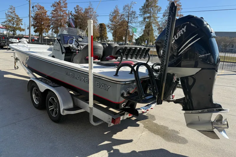 Slide: The Image of 2018 Blazer Bay 2420 GTS boat on trailer with Mercury Verado engine. - 5