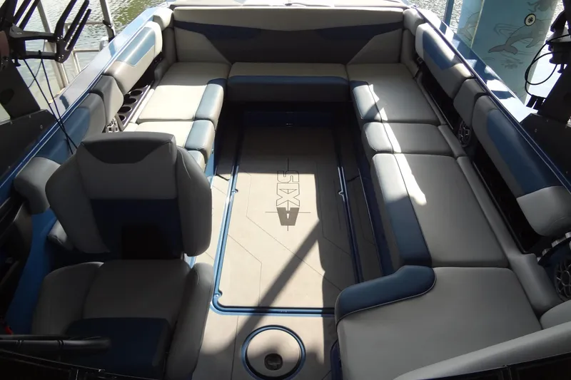 Slide: The Image of 2021 Axis A24 boat interior with spacious seating and modern design. - 11