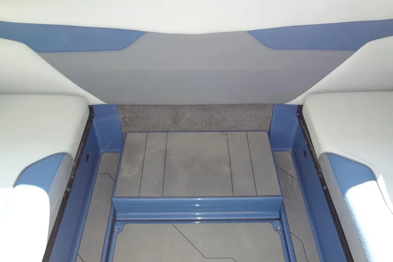Slide: The Image of 2021 Axis A24 boat interior with blue and gray seating and flooring. - 23