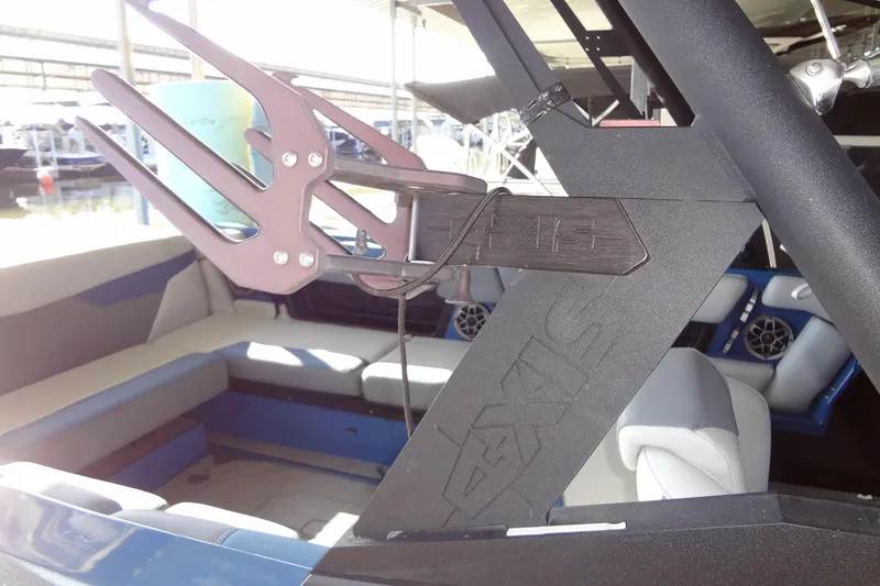 Slide: The Image of 2021 Axis A24 boat interior with wakeboard rack and seating. - 46