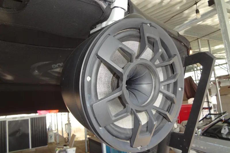 Slide: The Image of 2021 Axis A24 boat speaker system in a covered dock setting. - 49