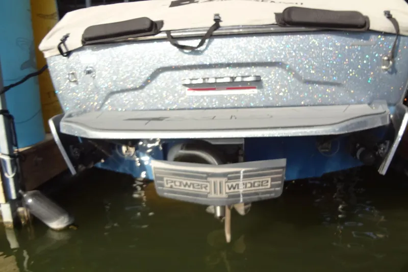 Slide: The Image of 2021 Axis A24 boat with Power Wedge III, docked in water. - 53