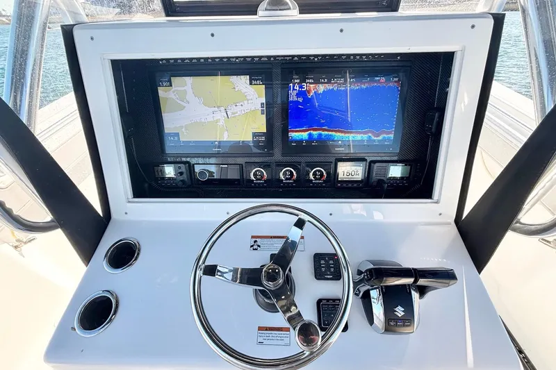 Slide: The Image of 2024 SeaHunter 39 Tournament helm with advanced navigation and control systems. - 12