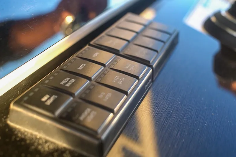 Slide: The Image of Control panel of 2022 World Cat 400 CC-X boat with labeled buttons. - 15