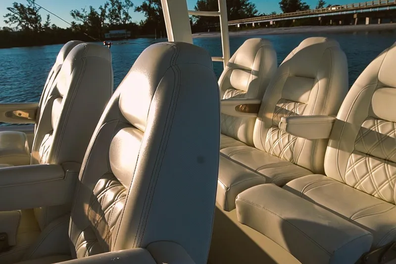 Slide: The Image of Luxurious seating on 2022 World Cat 400 CC-X boat, with elegant design and waterfront view. - 16