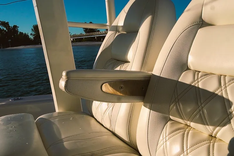 Slide: The Image of Luxurious seating on 2022 World Cat 400 CC-X boat with elegant stitching and armrest. - 17