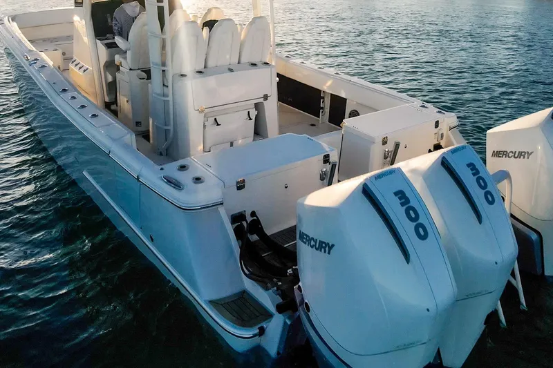 Slide: The Image of 2022 World Cat 400 CC-X boat with dual Mercury 300 engines on water. - 19