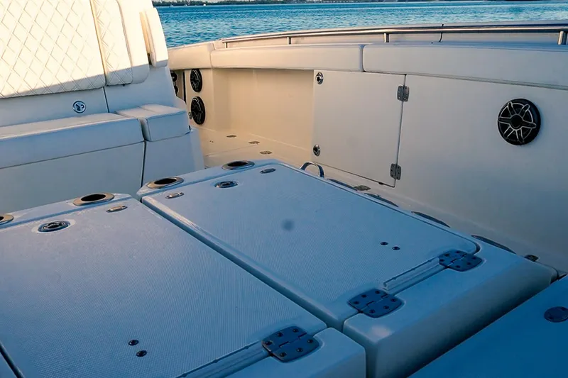 Slide: The Image of 2022 World Cat 400 CC-X boat interior with seating and storage compartments. - 22