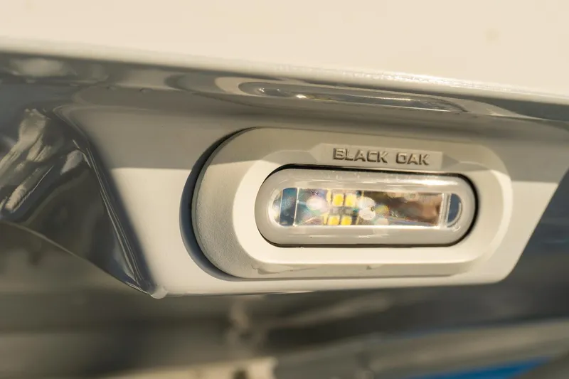 Slide: The Image of Close-up of Black Oak light on 2022 World Cat 400 CC-X boat. - 28