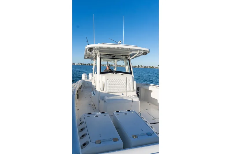 Slide: The Image of 2022 World Cat 400 CC-X boat on water, showcasing spacious deck and helm. - 30