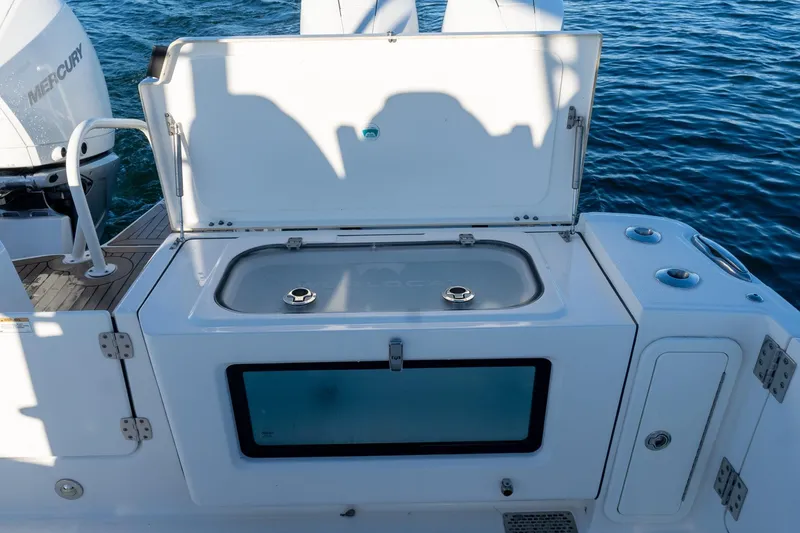 Slide: The Image of 2022 World Cat 400 CC-X boat with open storage compartment on deck. - 33