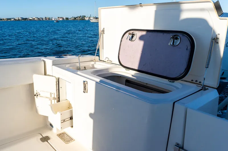 Slide: The Image of 2022 World Cat 400 CC-X boat with open storage compartment on deck. - 37