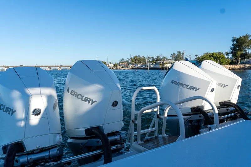 Slide: The Image of Four Mercury outboard engines on a 2022 World Cat 400 CC-X boat. - 38