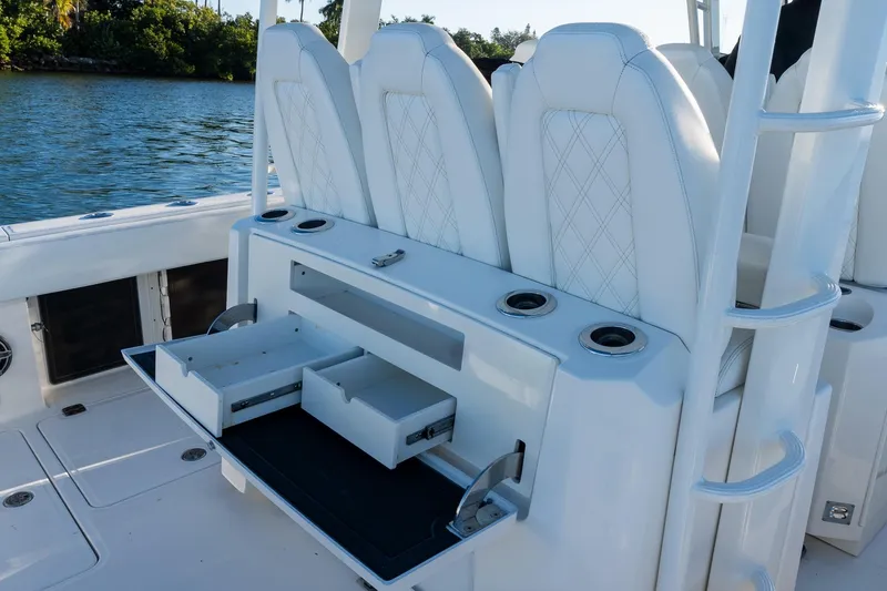 Slide: The Image of 2022 World Cat 400 CC-X boat with open storage drawers and white seating. - 41