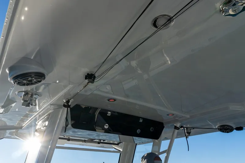 Slide: The Image of 2022 World Cat 400 CC-X boat interior with speakers and fishing rod holders. - 46