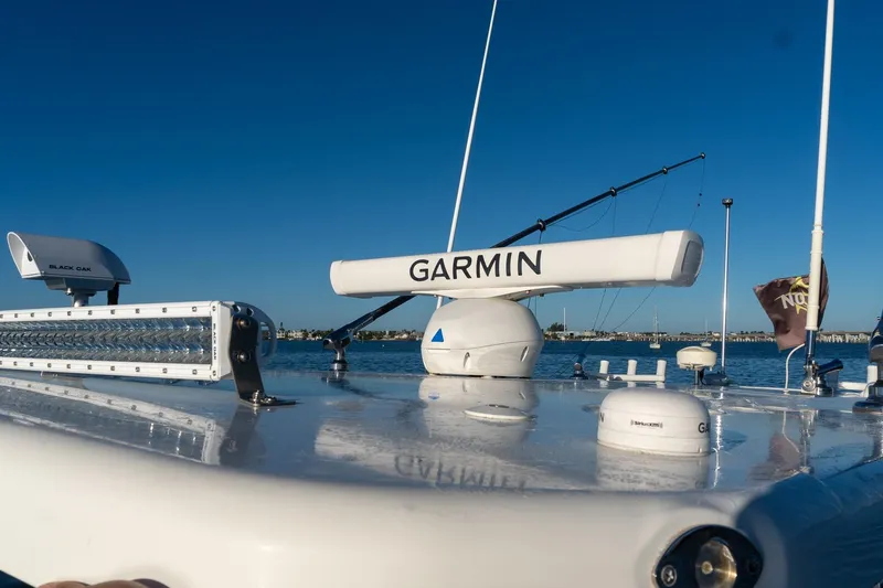 Slide: The Image of 2022 World Cat 400 CC-X boat with Garmin radar and Black Oak light bar on deck. - 47