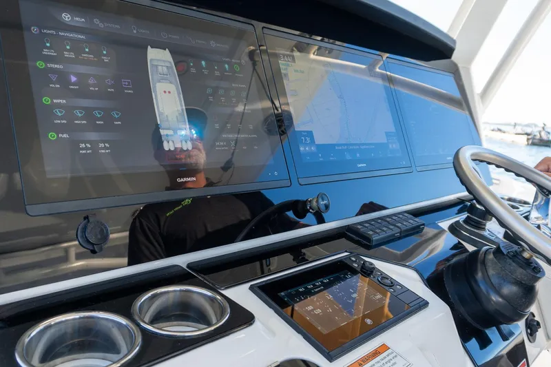 Slide: The Image of Control panel of 2022 World Cat 400 CC-X boat with advanced navigation displays. - 53