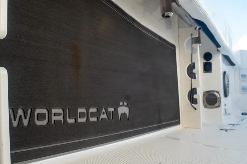 Slide: The Image of 2022 World Cat 400 CC-X boat interior with logo and equipment details. - 59